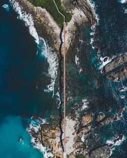 High angle view of rocks in sea