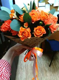 Close-up of woman holding bouquet