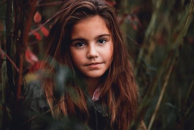 Portrait of girl amidst plants