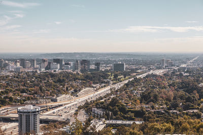 High angle view of buildings in city against sky