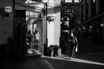 People walking on street in city