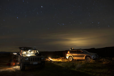 Off-road vehicle and suv at gifford pinchot national forest during night