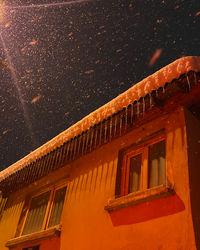 Low angle view of building against sky at night