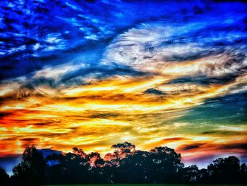 Scenic view of dramatic sky at sunset