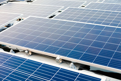Low angle view of cables against blue sky