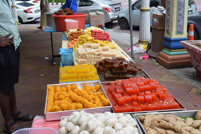 Man for sale at market stall