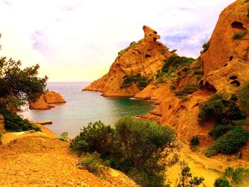 Scenic view of sea against cloudy sky