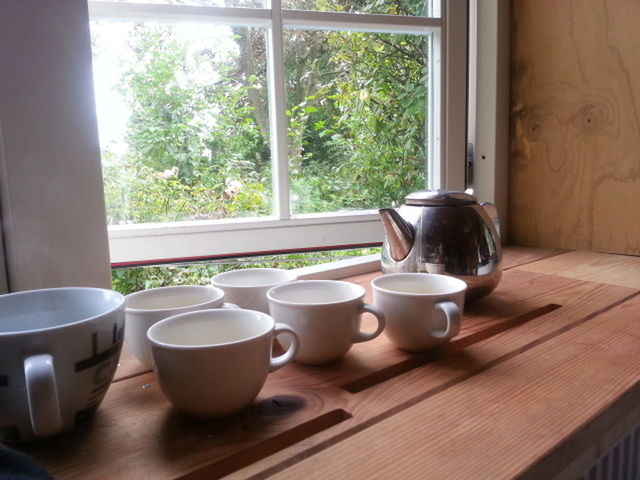 indoors, table, drink, food and drink, coffee cup, refreshment, coffee - drink, window, cup, freshness, coffee, saucer, still life, chair, home interior, glass - material, tea cup, window sill, empty, glass