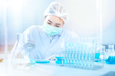 Scientist working at table in laboratory