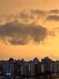 Cityscape against sky during sunset