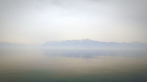 Scenic view of mountains during foggy weather