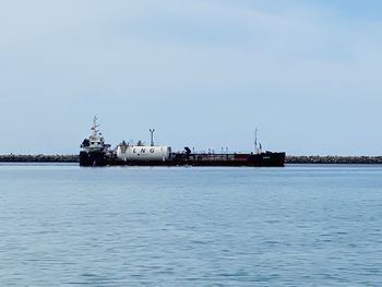 Ship in sea against sky