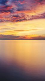 Scenic view of sea against dramatic sky