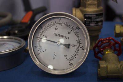 Close-up of clock on table