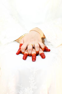 Close-up of woman lying on bed