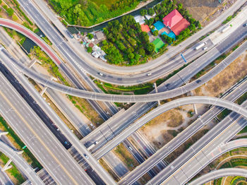 High angle view of highway amidst trees in city