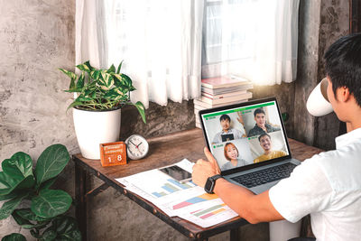 People sitting on table at home