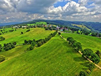 Scenic view of landscape against cloudy sky