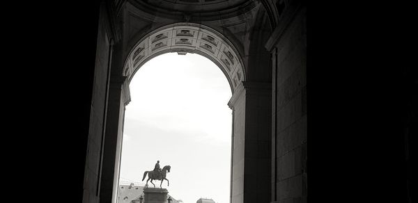 Low angle view of statue against sky