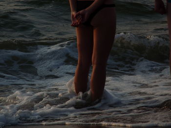 Low section of woman on beach