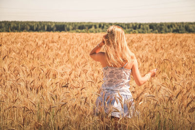 Woman standing on field