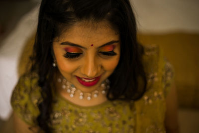 Close-up portrait of a smiling young woman