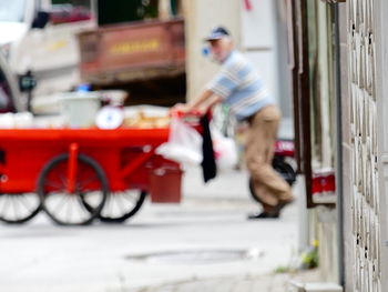 Man cycling on bicycle in city