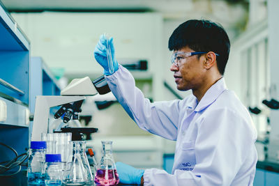 Scientist analyzing medical sample in laboratory