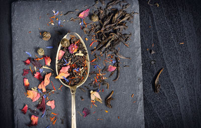 Directly above shot of dry spices on slate