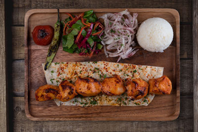 High angle view of meat on barbecue grill