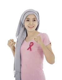 Portrait of a smiling young woman over white background