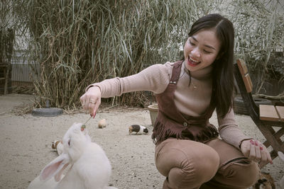 Portrait of young woman with dog