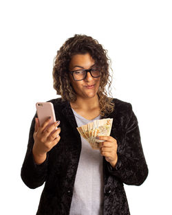 Young woman using smart phone against white background