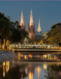 Reflection of illuminated building in water