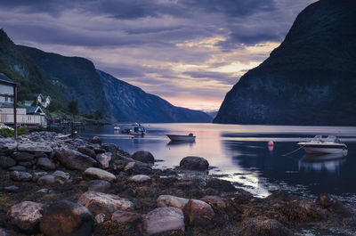 Scenic view of lake and mountains against sky