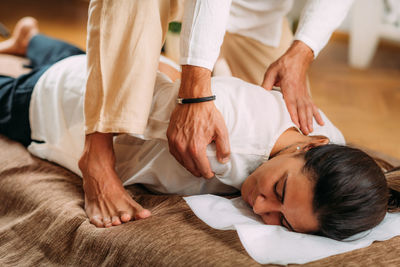 Woman enjoying shiatsu neck and shoulders massage.