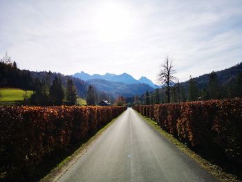 Surface level of empty road against sky