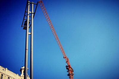 Low angle view of built structure against clear blue sky