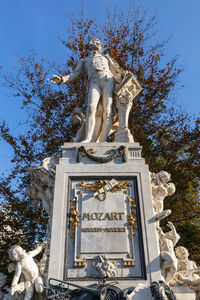 Low angle view of statue against sky