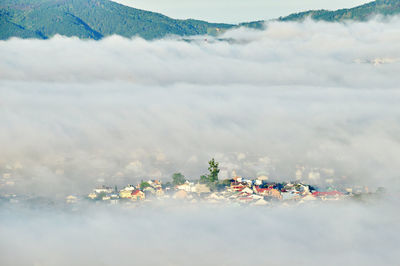 Panoramic view of sea against buildings