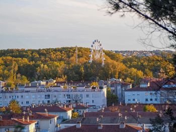 High angle view of townscape and trees against sky