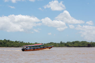 Boat in sea against sky