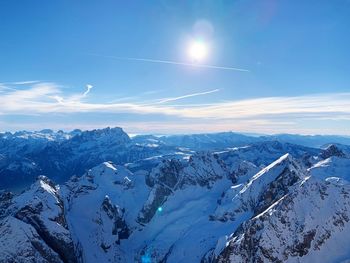 Scenic view of snowcapped mountains against sky