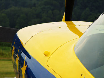 Close-up of yellow airplane