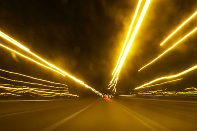 Blurred motion of car moving on road at night
