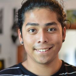 Close-up portrait of smiling mid adult man