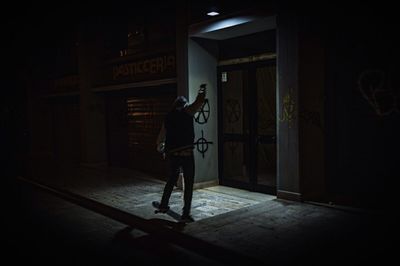 Full length of woman standing by railing