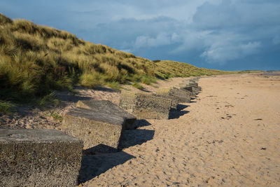 Shadow on sand dune against sky