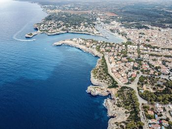 Aerial view of sea by townscape