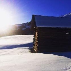 Scenic view of snow covered mountains against sky